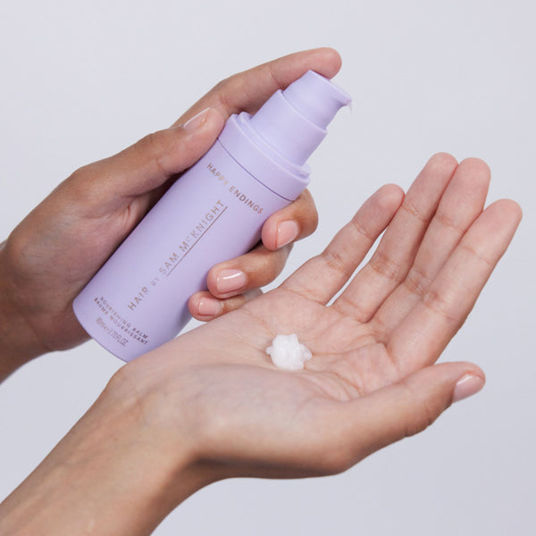 Hair by Sam McKnight Happy Endings Nourishing Balm hand using bottle