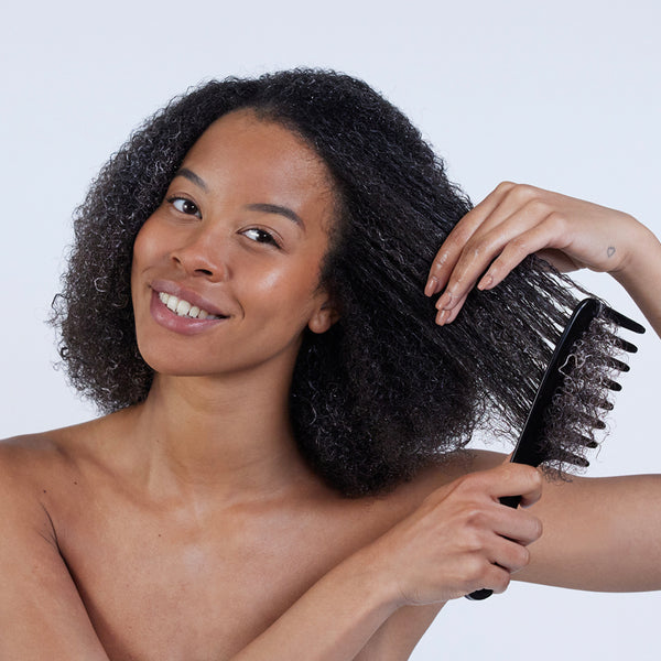 Hair by Sam McKnight Deeper Love Hair Mask model brushing through product